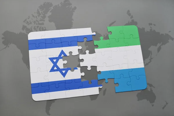 Puzzle with the national flag of israel and sierra leone on a world map background. — Stock Photo, Image