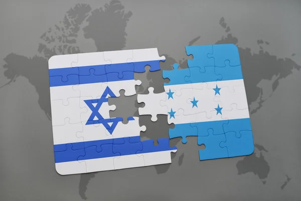 Puzzle with the national flag of israel and honduras on a world map background. — Stock Photo, Image