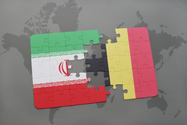 bir dünya haritası arka plan üzerinde İran ve Belçika ulusal bayrağı ile bulmaca.