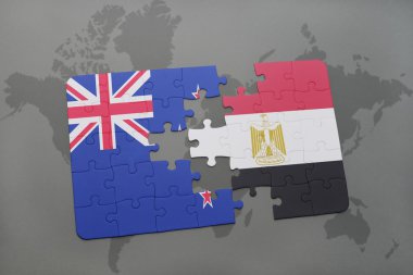 bir dünya haritası arka plan üzerinde Yeni Zelanda ve Mısır ulusal bayrağı ile bulmaca.