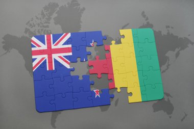 bir dünya haritası arka plan üzerinde Yeni Zelanda ve Gine ulusal bayrağı ile bulmaca.