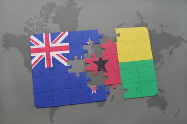 bir dünya haritası arka plan üzerinde Yeni Zelanda ve Gine bissau ulusal bayrağı ile bulmaca.