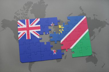 bir dünya haritası arka plan üzerinde Yeni Zelanda ve namibya ulusal bayrağı ile bulmaca.