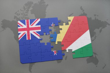 bir dünya haritası arka plan üzerinde Yeni Zelanda ve seyşeller ulusal bayrağı ile bulmaca.