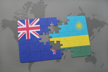 bir dünya haritası arka plan üzerinde Yeni Zelanda ve Ruanda ulusal bayrağı ile bulmaca.