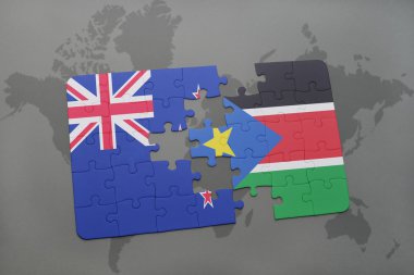 Yeni Zelanda ve dünya harita arka plan üzerinde Güney sudan bayrağı ile bulmaca.