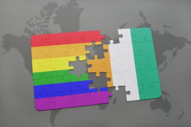 bir dünya haritası arka plan üzerinde cote divoire ve gay gökkuşağı bayrağı ulusal bayrağı ile bulmaca.