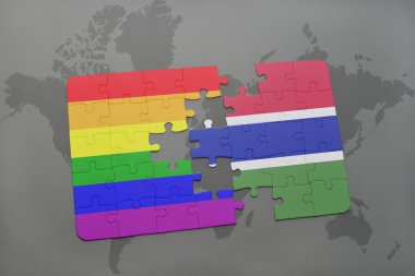 bir dünya haritası arka plan üzerinde gambiya ve eşcinsel gökkuşağı bayrağı ulusal bayrağı ile bulmaca.