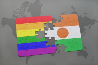 bir dünya haritası arka plan üzerinde nijer ve eşcinsel gökkuşağı bayrağı ulusal bayrağı ile bulmaca.