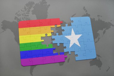 bir dünya haritası arka plan üzerinde somali ve eşcinsel gökkuşağı bayrağı ulusal bayrağı ile bulmaca.