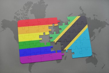 tanzanya ulusal bayrağı ve bir dünya haritası arka plan üzerinde eşcinsel gökkuşağı bayrağı ile bulmaca.