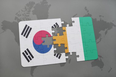 bir dünya haritası arka plan üzerinde güney kore ve cote divoire ulusal bayrağı ile bulmaca.