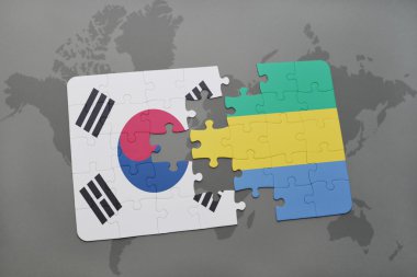 bir dünya haritası arka plan üzerinde güney kore ve gabon ulusal bayrağı ile bulmaca.