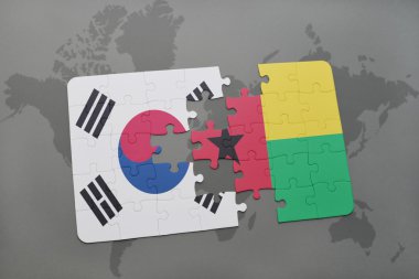 bir dünya haritası arka plan üzerinde güney kore ve gine bissau ulusal bayrağı ile bulmaca.