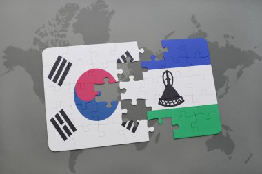 bir dünya haritası arka plan üzerinde güney kore ve lesotho ulusal bayrağı ile bulmaca.