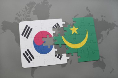 bir dünya haritası arka plan üzerinde Güney Kore ve Moritanya ulusal bayrağı ile bulmaca.