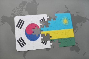 bir dünya haritası arka plan üzerinde Güney Kore ve Ruanda ulusal bayrağı ile bulmaca.