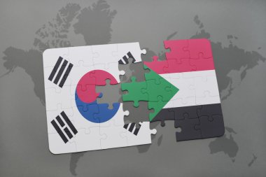bir dünya haritası arka plan üzerinde Güney Kore ve Sudan ulusal bayrağı ile bulmaca.