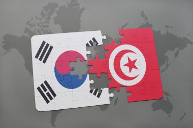 bir dünya haritası arka plan üzerinde Güney Kore ve Tunus ulusal bayrağı ile bulmaca.