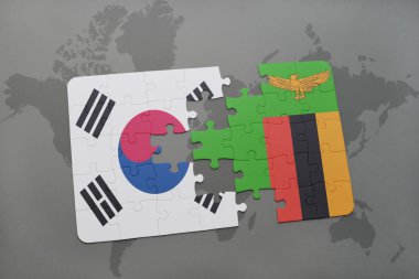 bir dünya haritası arka plan üzerinde Güney Kore ve Zambiya ulusal bayrağı ile bulmaca.