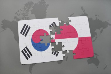 bir dünya haritası arka plan üzerinde Güney Kore ve Grönland ulusal bayrağı ile bulmaca.