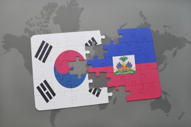 bir dünya haritası arka plan üzerinde Güney Kore ve Haiti ulusal bayrağı ile bulmaca.