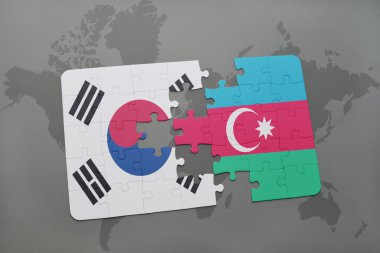 bir dünya haritası arka plan üzerinde güney kore ve azerbaycan ulusal bayrağı ile bulmaca.