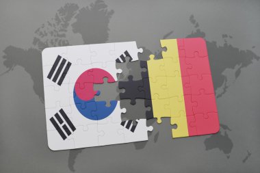 bir dünya haritası arka plan üzerinde Güney Kore ve Belçika ulusal bayrağı ile bulmaca.