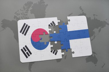 bir dünya haritası arka plan üzerinde Güney Kore ve Finlandiya ulusal bayrağı ile bulmaca.