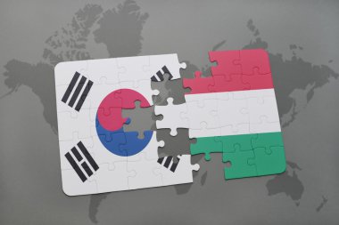 bir dünya haritası arka plan üzerinde Güney Kore ve Macaristan ulusal bayrağı ile bulmaca.