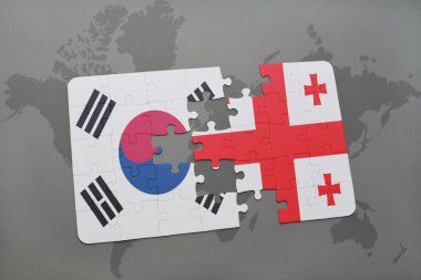 bir dünya haritası arka plan üzerinde Güney Kore ve Gürcistan ulusal bayrağı ile bulmaca.