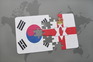 bir dünya haritası arka plan üzerinde Güney Kore ve Kuzey İrlanda ulusal bayrağı ile bulmaca.