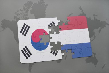 bir dünya haritası arka plan üzerinde Güney Kore ve Hollanda ulusal bayrağı ile bulmaca.