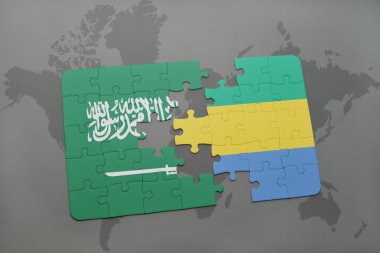 bir dünya haritası arka plan üzerinde Suudi Arabistan ve gabon ulusal bayrağı ile bulmaca.