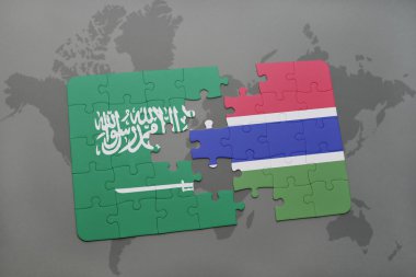 bir dünya haritası arka plan üzerinde Suudi Arabistan ve Gambiya ulusal bayrağı ile bulmaca.