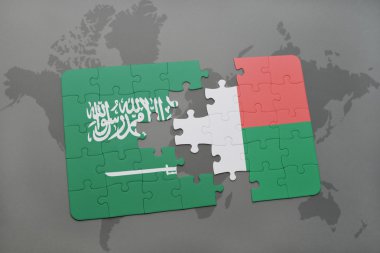 bir dünya haritası arka plan üzerinde Suudi Arabistan ve madagaskar ulusal bayrağı ile bulmaca.