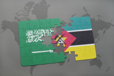bir dünya haritası arka plan üzerinde Suudi Arabistan ve Mozambik ulusal bayrağı ile bulmaca.