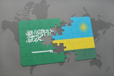 bir dünya haritası arka plan üzerinde Suudi Arabistan ve Ruanda ulusal bayrağı ile bulmaca.