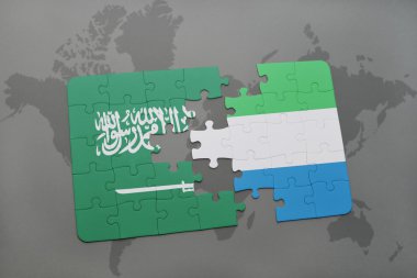 bir dünya haritası arka plan üzerinde Suudi Arabistan ve Sierra Leone ulusal bayrağı ile bulmaca.