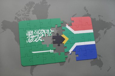 bir dünya haritası arka plan üzerinde Suudi Arabistan ve Güney Afrika ulusal bayrağı ile bulmaca.