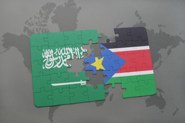 bir dünya haritası arka plan üzerinde Suudi Arabistan ve Güney Sudan ulusal bayrağı ile bulmaca.
