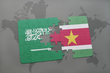 bir dünya haritası arka plan üzerinde Suudi Arabistan ve surinam ulusal bayrağı ile bulmaca.
