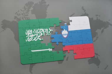Suudi Arabistan ve Slovenya ulusal bayrak dünya harita arka plan üzerinde ile bulmaca.