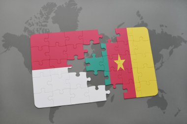 bir dünya haritası arka plan üzerinde endonezya ve Kamerun ulusal bayrağı ile bulmaca.