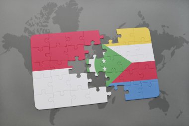bir dünya haritası arka plan üzerinde endonezya ve komor ulusal bayrağı ile bulmaca.