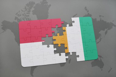 bir dünya haritası arka plan üzerinde endonezya ve cote divoire ulusal bayrağı ile bulmaca.