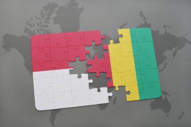 bir dünya haritası arka plan üzerinde endonezya ve gine ulusal bayrağı ile bulmaca.