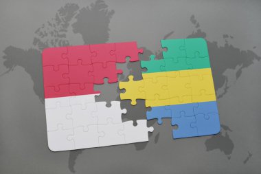 bir dünya haritası arka plan üzerinde endonezya ve gabon ulusal bayrağı ile bulmaca.
