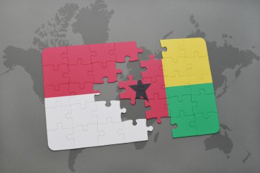 bir dünya haritası arka plan üzerinde endonezya ve gine bissau ulusal bayrağı ile bulmaca.