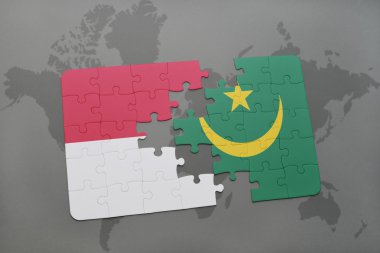 bir dünya haritası arka plan üzerinde endonezya ve moritanya ulusal bayrağı ile bulmaca.